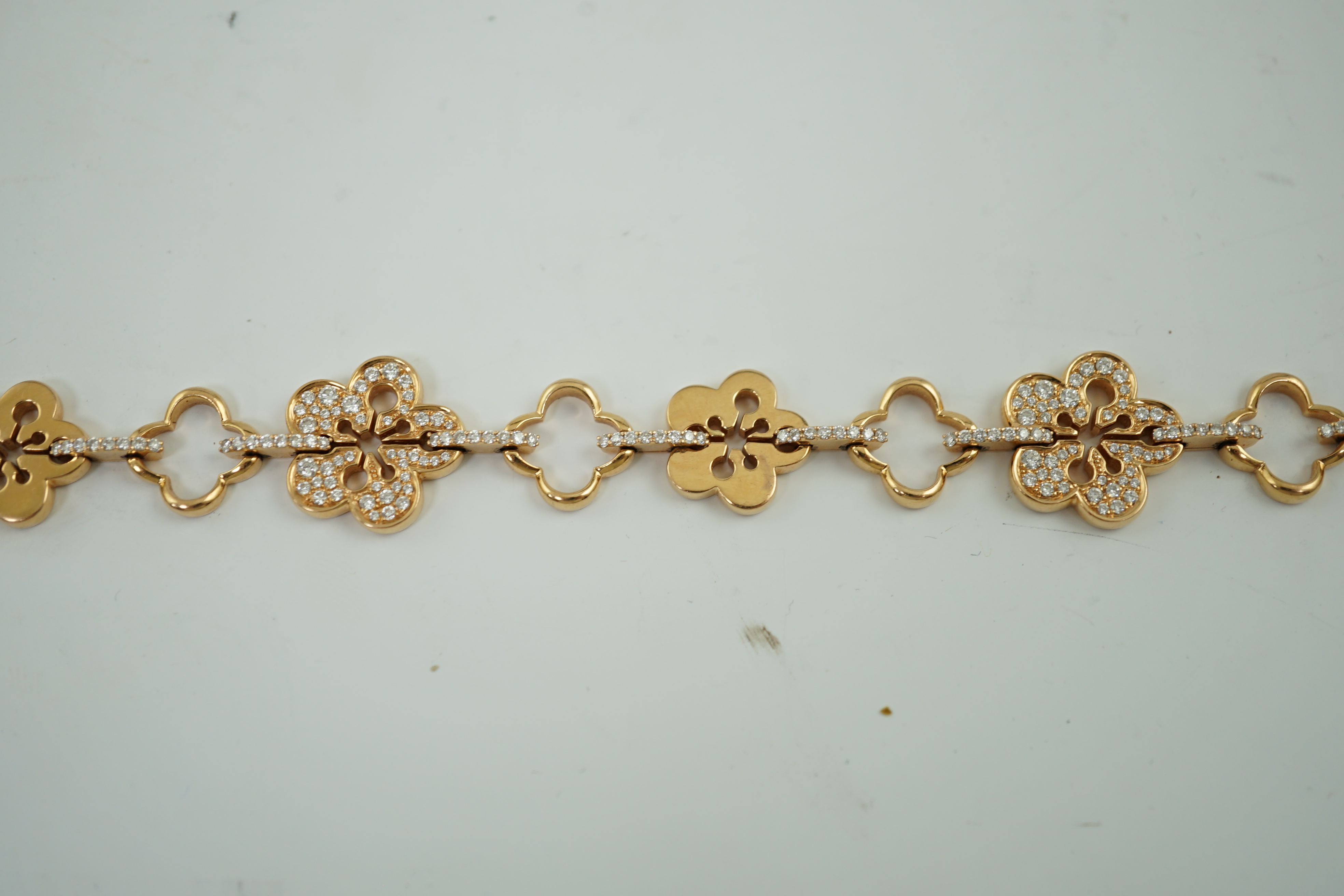 A modern suite of Boodles & Dunthorne 18ct rose gold and diamond chip set jewellery